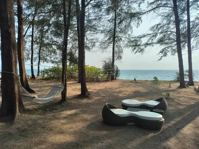 a playground with two seats on the beach at Heavenly place 777 on Mai Khao in Ban Mai Salae