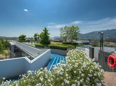a skate park with a ramp and some flowers at Bangtao , Laguna , 5 minutes from the bench, 2 bedroom in Ban Thalat Choeng Thale