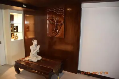 a statue sitting on a table in a room at KALIM RESIDENCE UNIT 133 VUE MER in Patong Beach