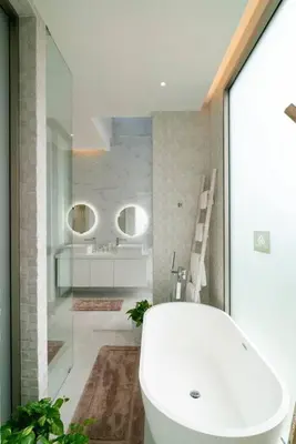 a bathroom with a white toilet and a sink at The Residence by Andaman Phuket in Ban Mut Dok Khao