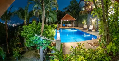 an overhead view of a swimming pool in a resort at Baiyok Villa seaview and edge pool in Patong Beach
