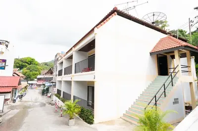 a view of a building with stairs on the side at Tri's Miracle Kata Beach Side in Kata Beach
