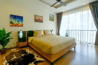 a bedroom with a bed and a television in it at 3bdr Townhouse In Laguna Park #118 by Capital Pro in Thalang