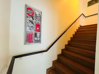 a picture of a coca cola sign on a wall at Country club townhouse in Bang Tao Beach