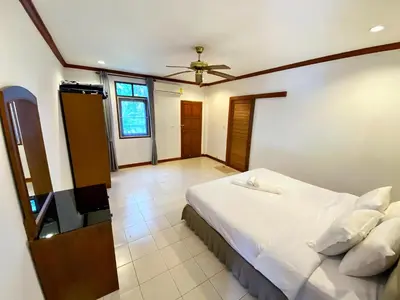 a bedroom with a white bed and a ceiling at Peaceful 2BR Garden Retreat Bangtao Beach A2 in Ban Thalat Choeng Thale