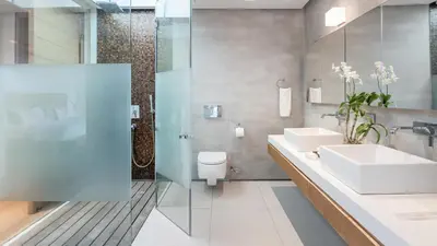 a bathroom with two sinks and a shower at Villa Saengootsa in Phuket Town