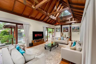 a living room with a couch and a tv at Villa Horizon in Phuket Town