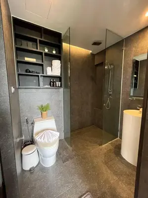 a bathroom with a toilet and a shower at Citygate in Kamala beach - Perfect Stay for Digital Work in Kamala Beach