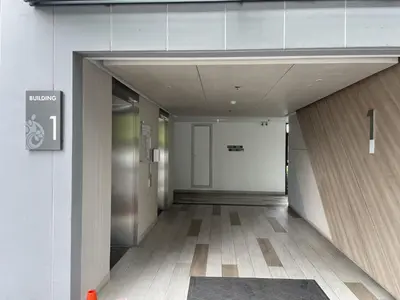 a hallway of a building with a elevator at Best location in Laguna-modern apartment at Cassia in Bang Tao Beach