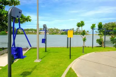 a park with a view of the water at Best location in Laguna-modern apartment at Cassia in Bang Tao Beach