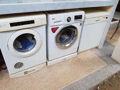 two washing machines are sitting next to each other at ViewPoint Villa in Kathu