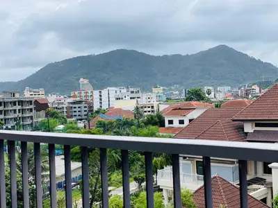 a view of a city with buildings and mountains at Coco boutique hotel in Patong Beach