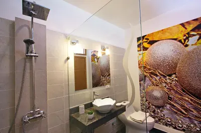 a bathroom with a shower and a toilet and a sink at The Inspiration Residence in Rawai Beach