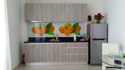 a kitchen with a counter with fruit on the wall at The Inspiration Residence in Rawai Beach
