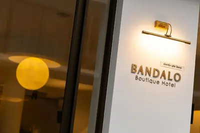a door sign for bandalo boutique hotel at Bandalo Boutique Hotel - Patong Beach Road in Patong Beach