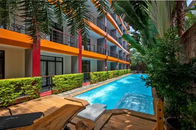 a swimming pool in front of a building at 1bdr apartment NaiHarn Beach condo by Capital Pro in Phuket Town