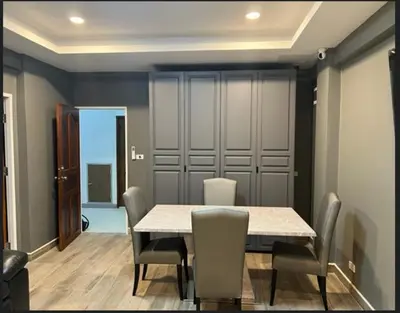 a dining room with a table and chairs at Patong Vacation Rentals - Located in the Heart of Patong, Studio Apartments walking distance to the beach, King Bed, Kitchen, Private Bathroom, Seating Area, 65