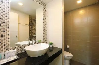 a bathroom with a sink and a toilet at 1bdr Apartment on the Kata Beach SPL-101 by Capital Pro in Phuket Town