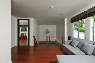 a living room with a couch and a table at Dolphin Villa in Patong Beach