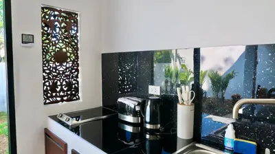 a kitchen with a sink and a window at Jasmine Village in Rawai Beach
