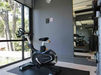 a gym with a exercise bike and a mirror at A401-Silk Condo Aonang, Sea view - 5 mins to beach in Krabi town