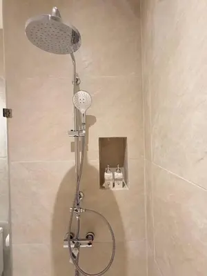 a shower with a shower head in a bathroom at Ton Sai Tropical Phi Phi Island in Phi Phi Don