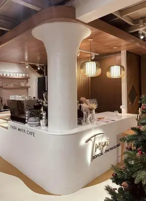 a restaurant with a counter with a christmas tree at Ton Sai Tropical Phi Phi Island in Phi Phi Don