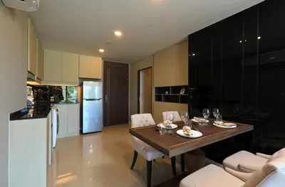 a kitchen and dining room with a table and chairs at 2bdr Apartment with Jacuzzi SeaView by CapitalPro 307 in Phuket Town