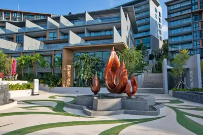 a building with a sculpture in front of it at 3 bdr SeaView Apartment walking to Surin Beach by CapitalPro in Phuket Town