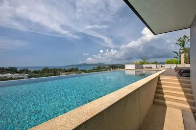 a swimming pool on top of a building at Mountain view Apartment Surin Beach 716 by CapitalPro in Phuket Town