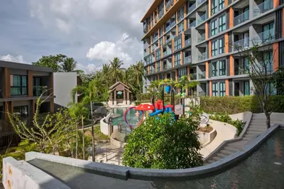 a playground in front of a apartment building at Mountain view Apartment Surin Beach 716 by CapitalPro in Phuket Town