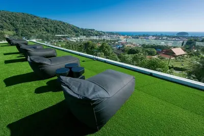 a row of chairs sitting on top of a roof at Villa Nordic Star Seaview Near Kata Beach in Kata Beach