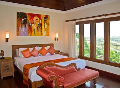 a bedroom with a bed and a large window at Villa Oriole in Layan Beach