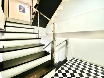 a staircase with a checkered floor in a building at Beachwalk Patong in Patong Beach