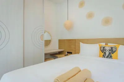 a bedroom with a white bed and a mirror at Modern Rustic 4 Bedrooms Villa, Walk to Rawai & Yanui Beach in Nai Harn Beach