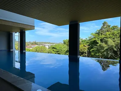 a view from the swimming pool of a house with trees at Great Hill Jungle View Pool Gym Naiyang in Nai Yang Beach