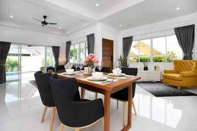 a dining room with a table and chairs at Private Pool Villa Rawai Beach in Rawai Beach
