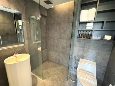 a bathroom with a shower and a sink and a toilet at Luxury private apartment Citygate by Lofty in Kamala Beach
