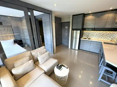 a living room with a couch and a table at Luxury private apartment Citygate by Lofty in Kamala Beach
