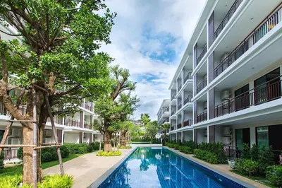 a swimming pool in the courtyard of a building at New Apartment TTL B209 in New Rawai Beach Residence with Tropical Pools in Rawai Beach