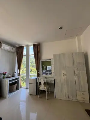 an office with a desk and a computer in a room at TIL DAWN Phuket in Karon Beach