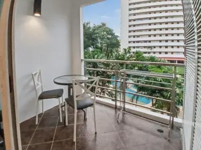 a balcony with a table and chairs and a view at Haven Lagoon Condominium in Patong Beach
