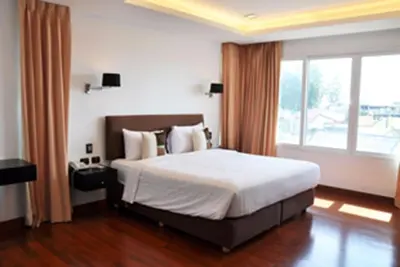 a bedroom with a large bed and a large window at Luxurious 3BR Penthouse Jacuzzi Seaview in Kamala Beach