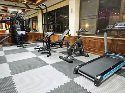 a gym with several exercise bikes and treadmills at Patong Central Residence & Apartment in Patong Beach