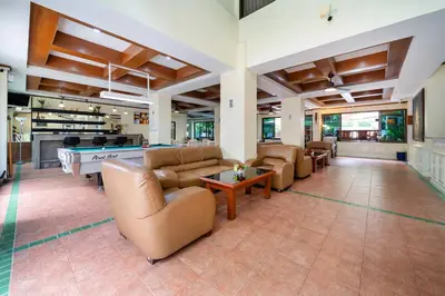 a large living room with couches and a pool table at Patong Central Residence & Apartment in Patong Beach