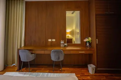 a room with a desk with two chairs and a mirror at Phuket Boutique Pool Villa-79 in Rawai Beach
