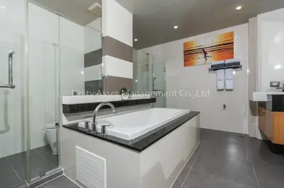a white bathroom with a sink and a toilet at The Unity and The Bliss Patong Residence in Patong Beach