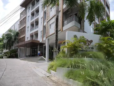 an empty street in front of a building at Karon beach apartment & sea view pool in Karon Beach