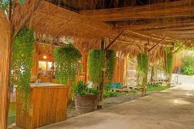 a pavilion with a sink and plants in it at Greenheart Garden View Camp Phuket in Kata Beach