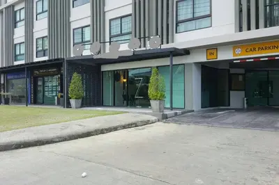 a building with a parking lot in front of it at At Laguna at Zcape Condo in Bang Tao Beach